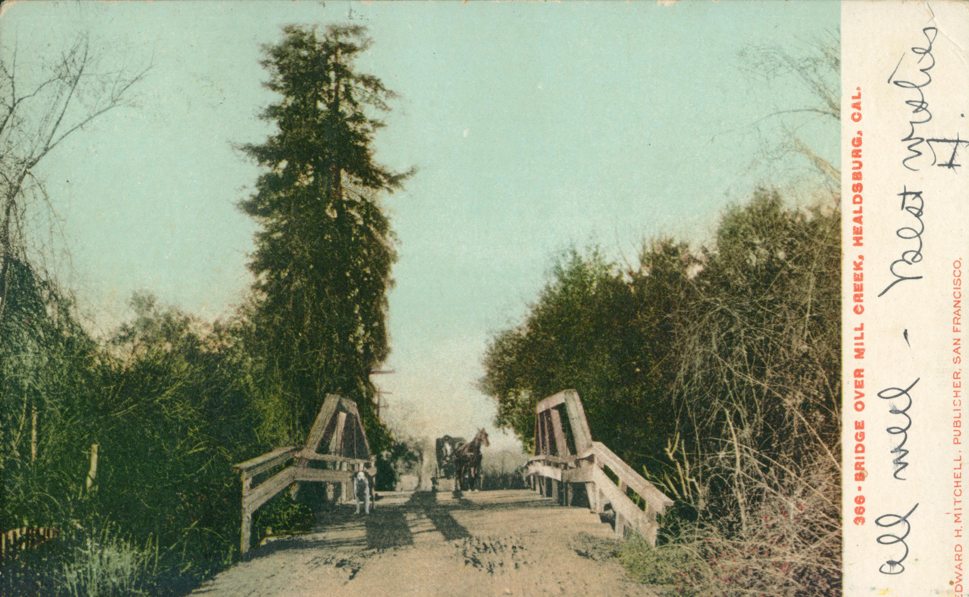 Shows a horse and carriage crossing a bridge